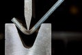 working with sheet metal on CNC hydraulic press brake. Bending sheet metal Royalty Free Stock Photo