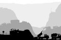 Working silhouette vehicles in canyon