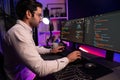 Working smart IT developer analyzing data software development on pc. Surmise.