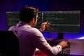 Working smart IT developer pointing data software development on pc. Surmise.