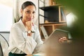 Working smarter not harder. a young businesswoman using her digital tablet at her desk.