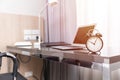 Working space at home or business desk table with alarm clock,  morning at home office hours work time concept Royalty Free Stock Photo