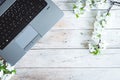 Working space with laptop spring flowers Royalty Free Stock Photo