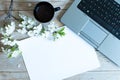 Working space with laptop spring flowers Royalty Free Stock Photo