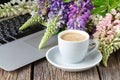 Working space or working place with laptop, flowers and coffee Royalty Free Stock Photo