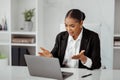 Working stress. Angry black businesswoman having problems with laptop computer, worried ceo sitting at desk in office Royalty Free Stock Photo