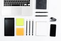 Working table top view, flat lay. Business items on a white table, laptop, clock, phone, pens, stickers. Copy Space, Concept of