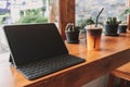Working tablet computer in coffee cafe. Concept of freelance creative work. Royalty Free Stock Photo