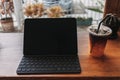 Working tablet computer in coffee cafe. Concept of freelance creative work. Royalty Free Stock Photo