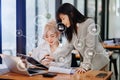 Working team meeting concept, business asian woman using laptop and smart phone and digital tablet computer with digital marketing Royalty Free Stock Photo