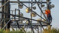 Working Technician up a telecommunications tower Royalty Free Stock Photo