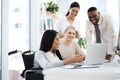 Working on their latest proposal. a group of diverse businesspeople having an informal meeting in their office. Royalty Free Stock Photo