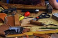 Leathercraft working tools on workshop desk Royalty Free Stock Photo