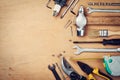 Working tools on wooden rustic background from above