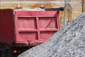 A working truck is preparing to unload gravel on the site to build a parking lot for tourist buses. The upper awning is Royalty Free Stock Photo