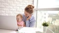 Working woman with baby speaking phone. Business mom with child Royalty Free Stock Photo