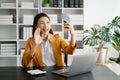 Working woman concept a female manager attending video conference and holding tablet, smatrphone in modern office Royalty Free Stock Photo