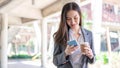 Working woman concept a young female manager attending video conference and holding a cup of coffee Royalty Free Stock Photo