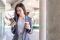 Working woman concept a young female manager attending video conference and holding a cup of coffee Royalty Free Stock Photo