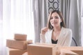 Working woman managing delivery for her online business store