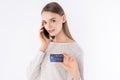 Working Woman with smart casual look presenting her credit card Royalty Free Stock Photo