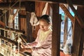Working woman by weaving