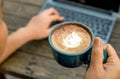 Working women with coffee late in the hand,Women are using laptops for work. Royalty Free Stock Photo