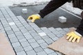 Workman Bricklayer Installing Brick Patio.