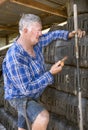 Workman checks mobile phone.