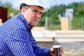 Workman drinking coffee in his hardhat Royalty Free Stock Photo