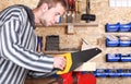 Workman with handsaw Royalty Free Stock Photo