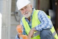 workman holding tape indoors