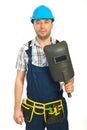 Workman holding welding mask