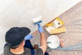 House painter at work painting a wall with a brush Royalty Free Stock Photo