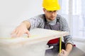 Workman measuring bathtub