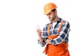 workman in orange overall and hard hat using smartphone