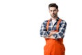 workman in orange overall standing with folded arms