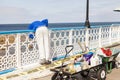 Workman painting seaside pier