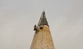 Workman on church spire, Sussex, England