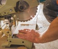 Workman sawing a piece of wood Royalty Free Stock Photo