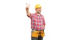 Workman showing peace or victory sign