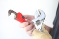 Workman with two wrenches Royalty Free Stock Photo