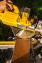 Workman using circular saw blade to cut wooden plank Royalty Free Stock Photo