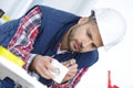 Workman using screwdriver on plug socket Royalty Free Stock Photo