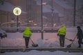 Workmans with shovel in snowy morning in Ceske Budejovice station CZ 02 12 2023