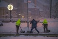 Workmans with shovel in snowy morning in Ceske Budejovice station CZ 02 12 2023