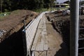 Concrete cinder block wall under construction.