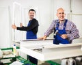 Workmen with finished PVC profiles Royalty Free Stock Photo