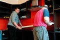 Workmen fitting kitchen