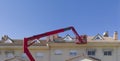 Workmen installing solar panels on the roof of a terraced house Royalty Free Stock Photo